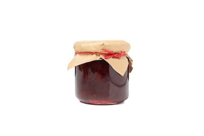Delicious strawberry jam isolated on blank background