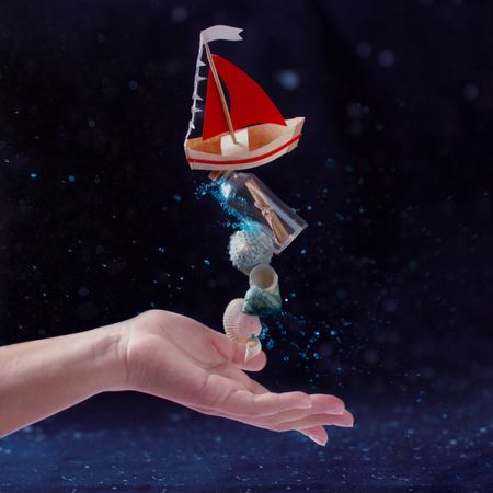 Charming composition of toy boat and seashells