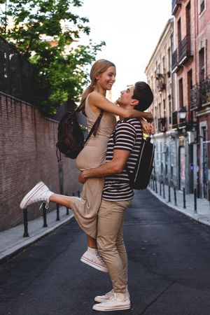 Happy couple having fun while walking in town