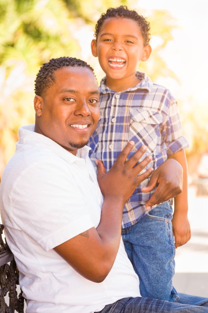 Portrait of Son and Father Outdoors Together.
