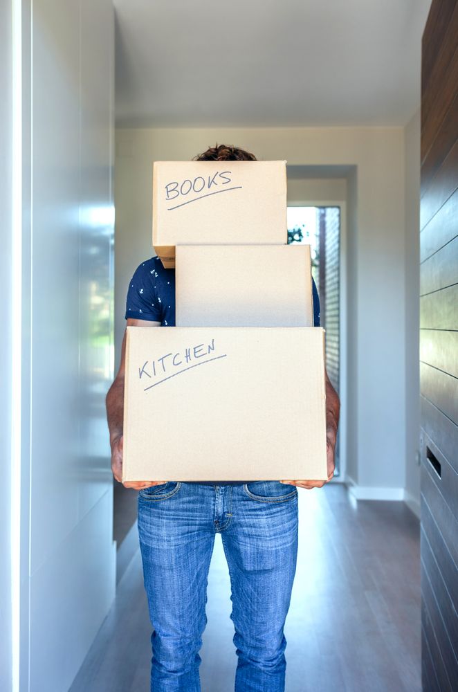 Man carrying moving boxes