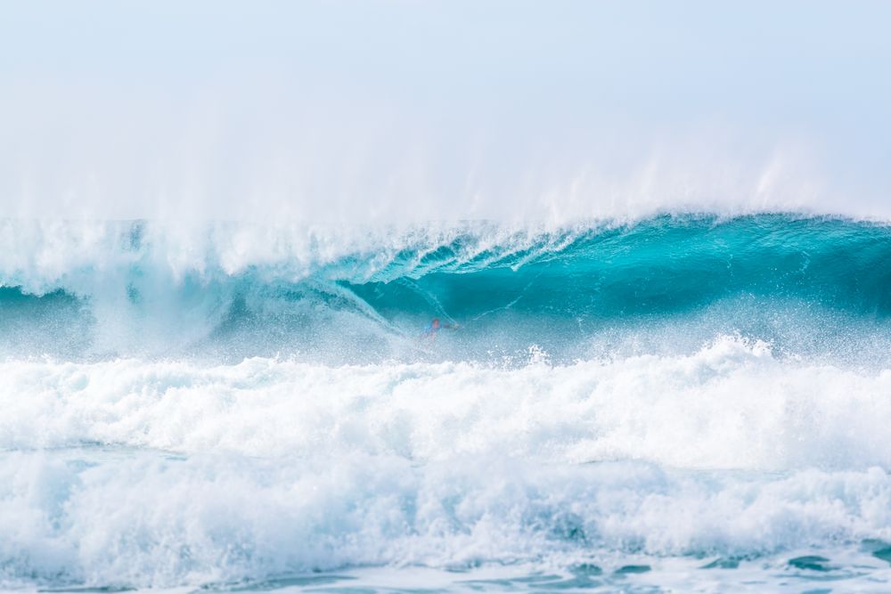 Huge ocean waves under sky