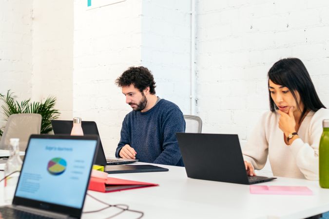 Group of multiracial people working with laptop in a coworking