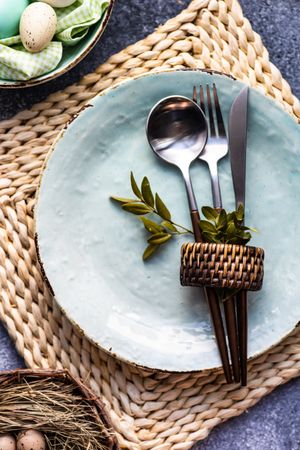 Easter holiday table setting with silverware and branch