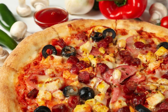 Tasty pizza and ingredients for cooking, close up