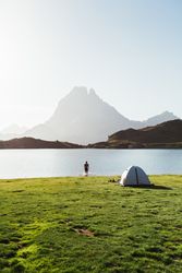Man near the tent in the mountain