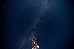 Radio tower against starry sky