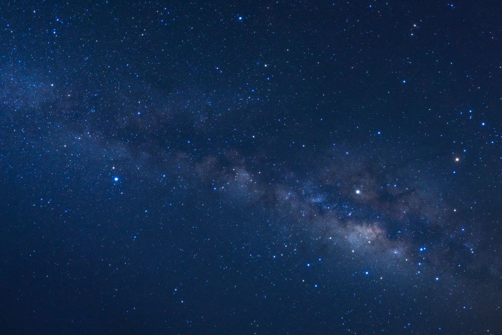 Starry night sky and milky way galaxy with stars and space dust in the universe