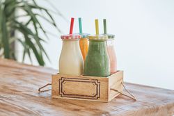 Smoothies bottles in wooden box