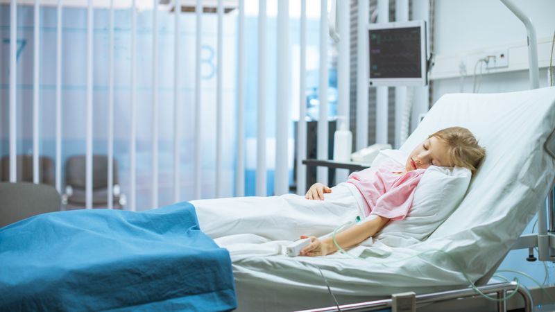 Cute Little Sick Girl Sleeps on a Bed in the Children's Hospital