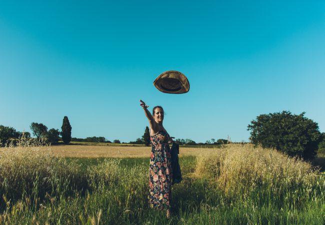 Female farmer with hat looking at camera