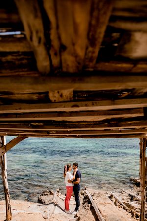 Peaceful lovers embracing on seashore