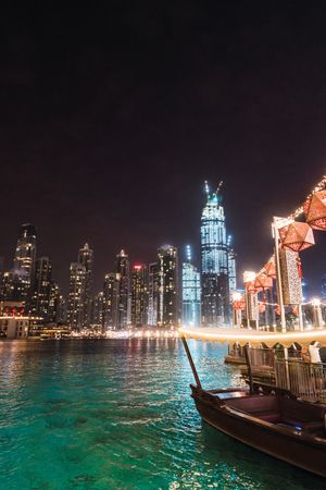 Boat and embankment in night metropolis