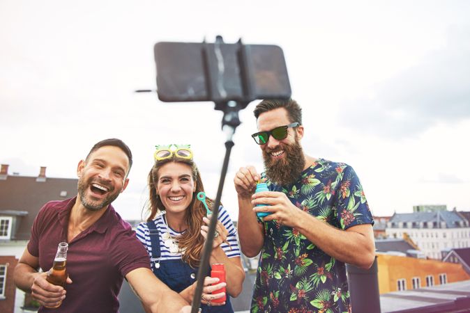 Group of people with selfie stick outside