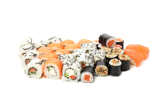Japanese food. Delicious sushi rolls isolated on light background