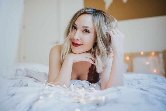 Woman lying in bed at home