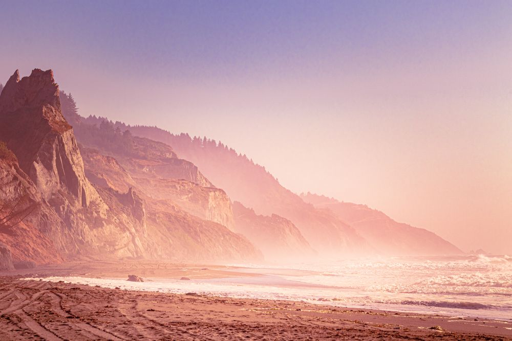 Waves coming into beautiful beach with cliffs