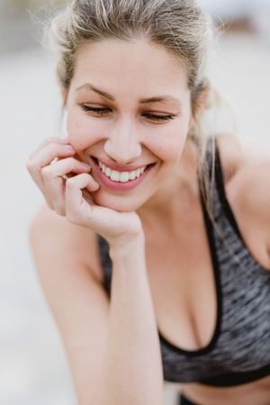 Sportswoman in active clothing smiling