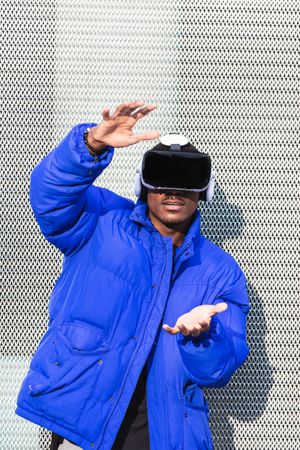 Black man experiencing virtual reality in city