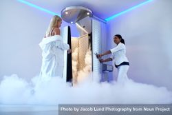 Cryotherapy technician guiding client 0WOxqW