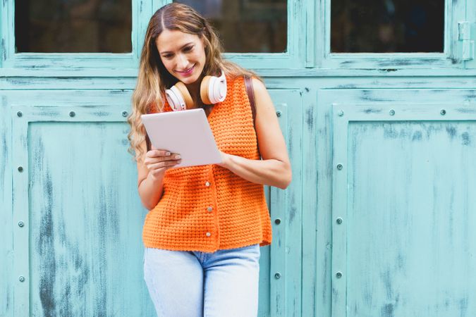 Woman checking tablet outside