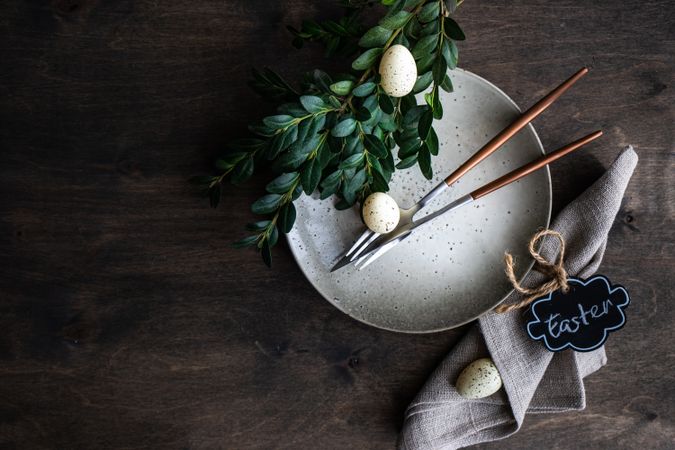 Top view of spring table setting with eggs and branch
