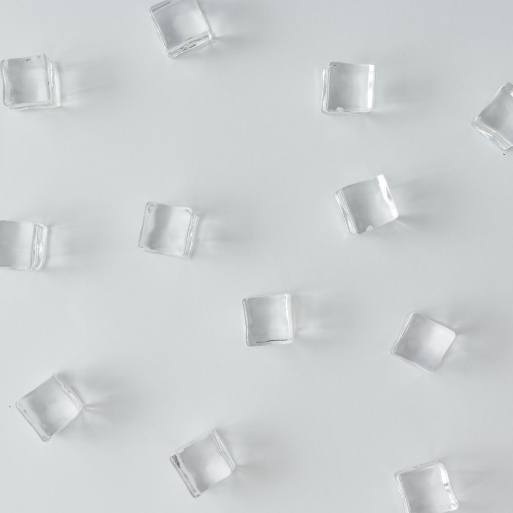 Ice cubes pattern on bright background