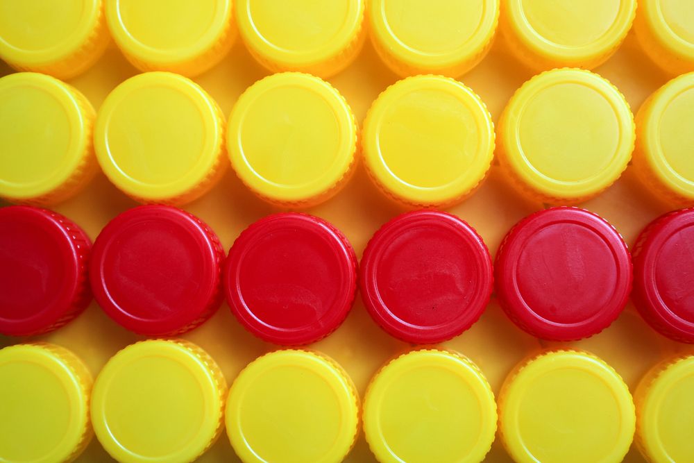 Yellow and Red Plastic Bottle Cup Background