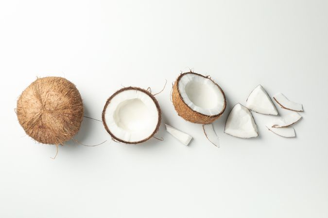 Flat lay with coconut on plain background, top view