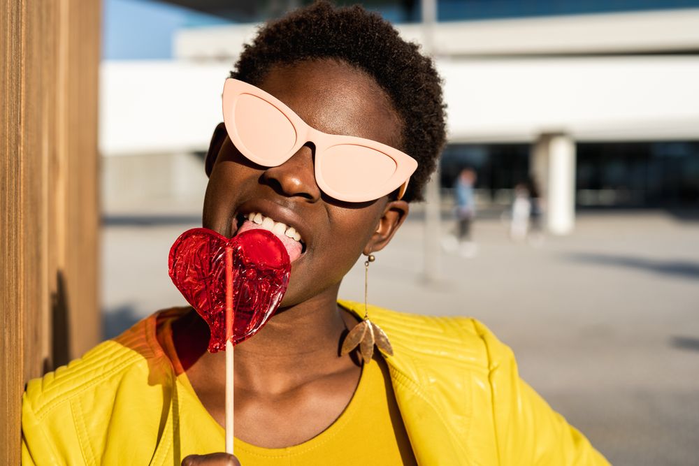 Black woman eating candy