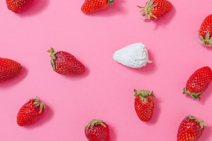 Strawberries against pink background
