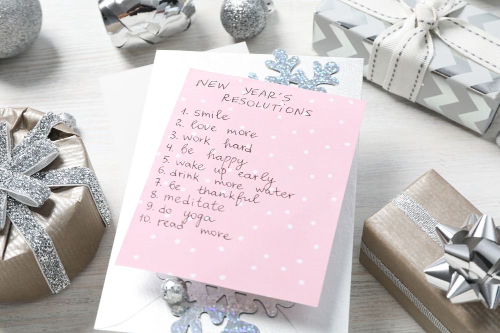 Concept of New Year Resolutions list, new year goals, close up