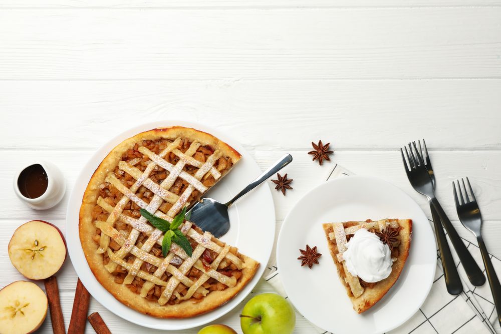Composition with apple pie on wooden background. Tasty lunch. Homemade breakfast