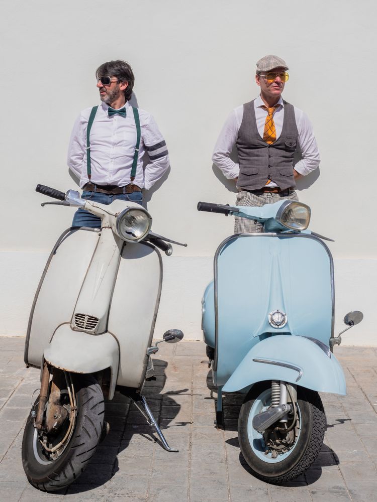 Trendy friends with vintage scooters