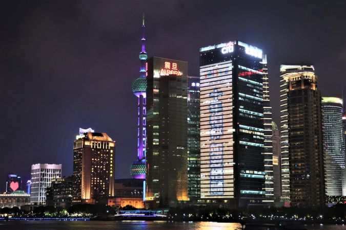 City buildings in Lujiazui, Pudong, Shanghai, China during nighttime
