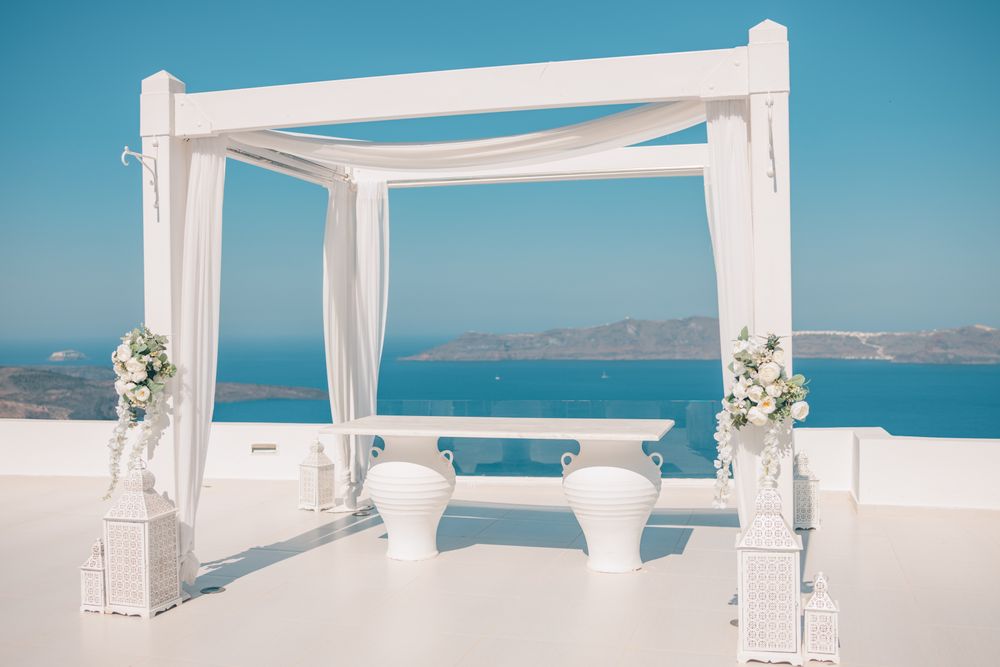 Canopy on a patio in Santorini with views of the sea below