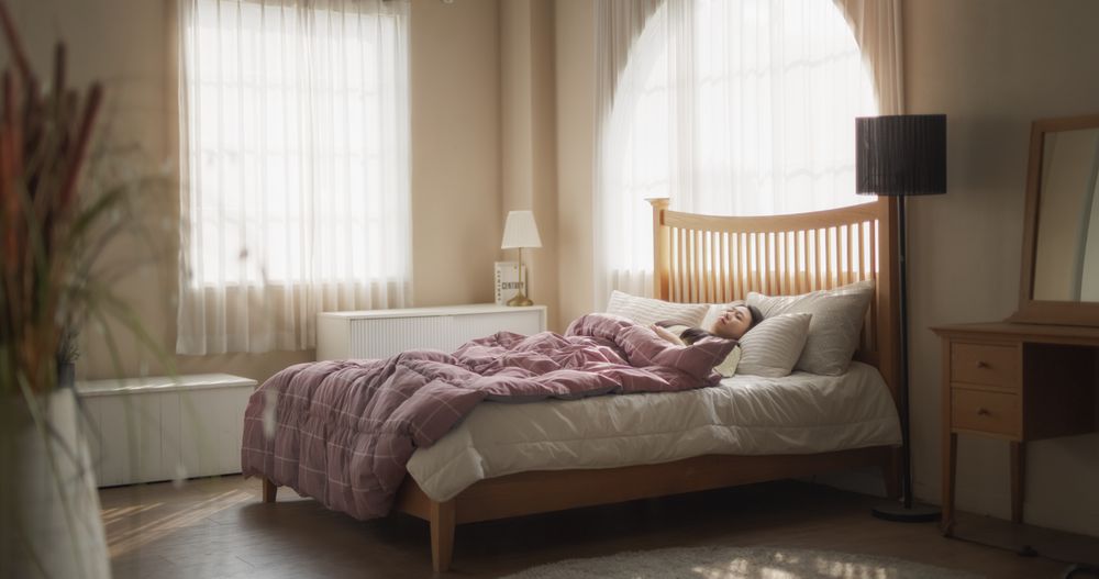 Young Asian Woman Waking up in the Morning, Stretching Her Neck