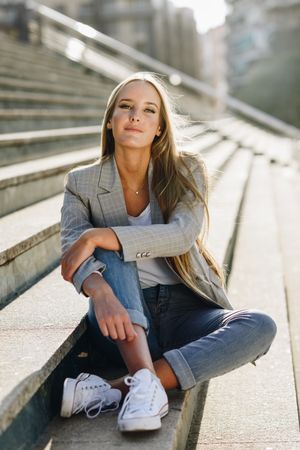 Portrait of woman sitting on steps