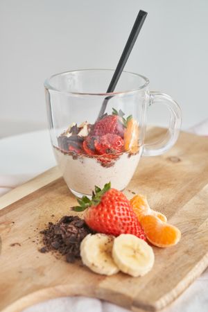 Strawberry smoothie with yogurt served on cutting board