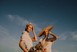 women in hats in bright sunny day