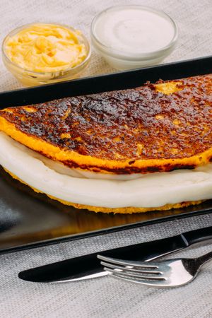 Cachapa, typical Venezuelan dish made with corn and stuffed with cheese