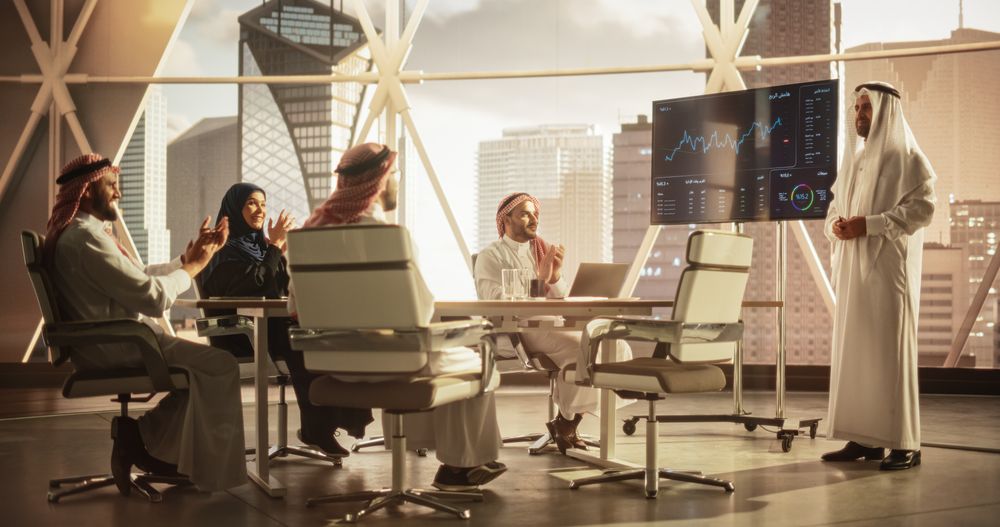 Muslim Businessman Holds Meeting Presentation for Diverse Business Partners. Managers Appreciate the Presentation,