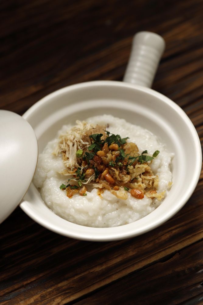 Top view of rice porridge on wooden table
