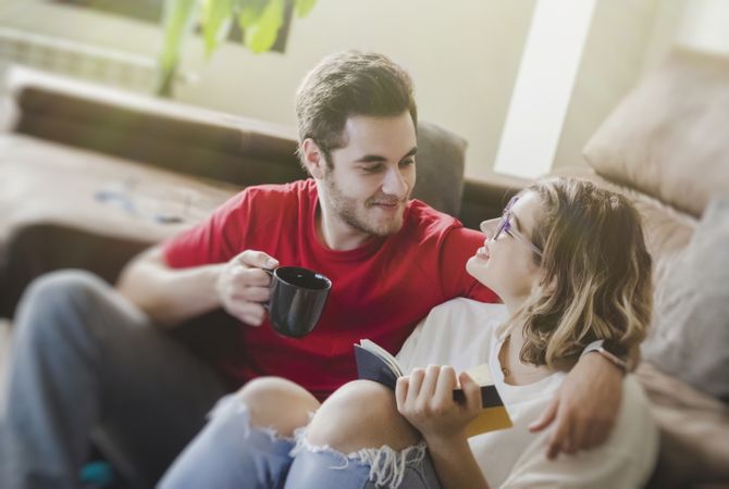 Couple sitting at couch together
