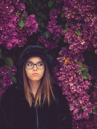 Woman on background of stunning violet flowers