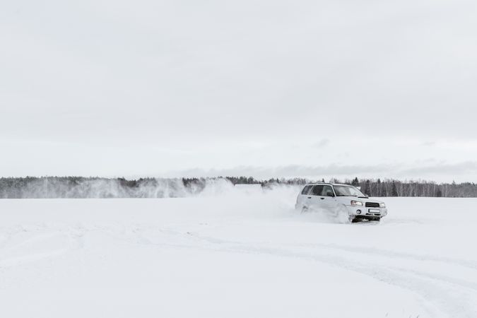 Car driving on snow field