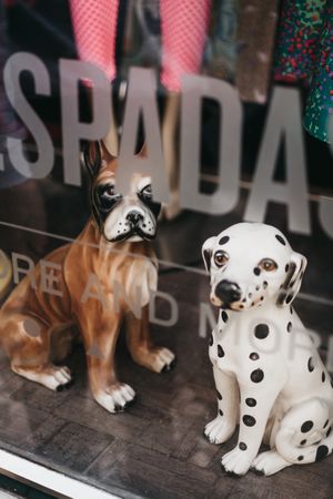 Porcelain dog statuettes in shop