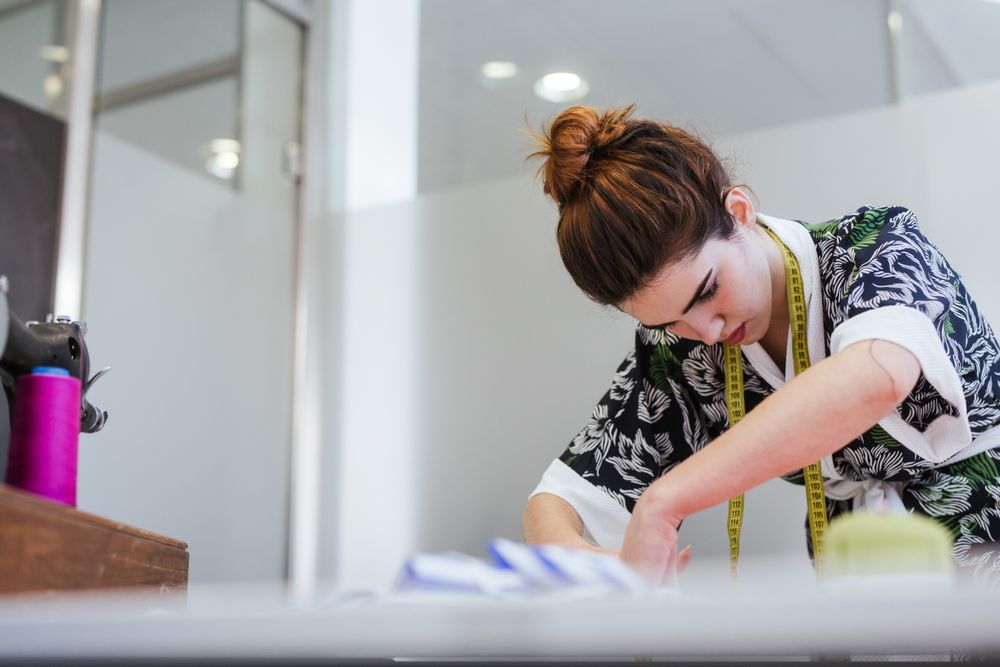 Woman in a sewing school