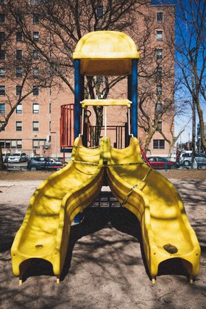 MONTREAL, QUEBEC, CANADA – March 31 2020- A playground is closed down with 'danger' yellow tape