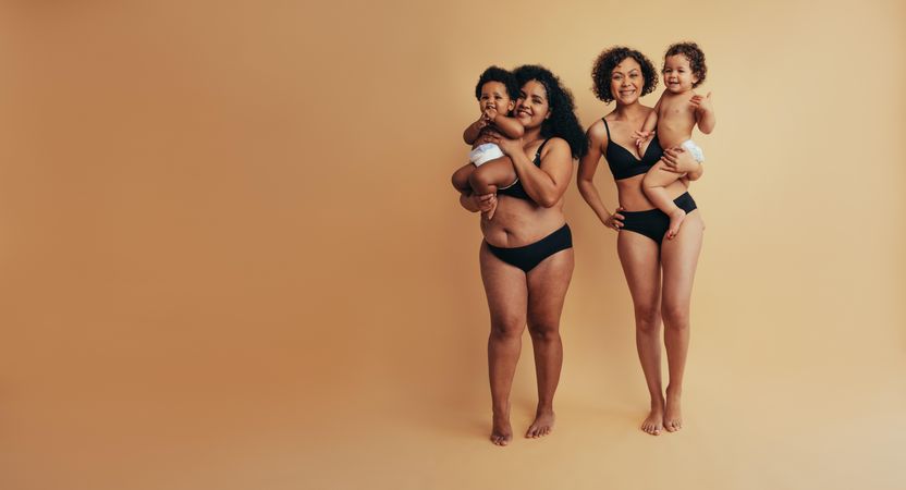 Young mothers proudly showing their mom bodies after giving birth to their babies